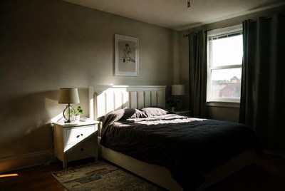 Cozy bedroom with afternoon sunlight