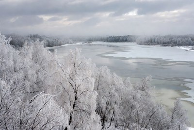 Winter landscape near a frozen river