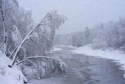 Winter river with snowy banks