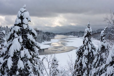 Snowy winter landscape with river