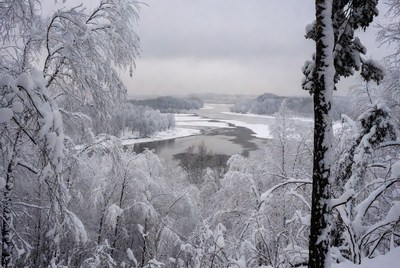 Snowy landscape by a river