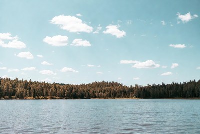 Lakeside view with clear blue skies