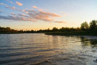 Golden sunset over serene lake