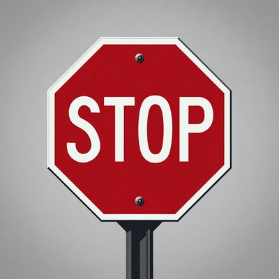 Red stop sign on a gray background