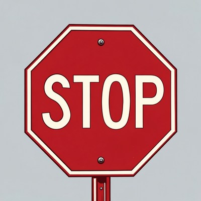 Red stop sign against gray sky