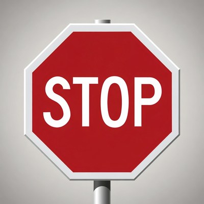 Stop sign at a road intersection