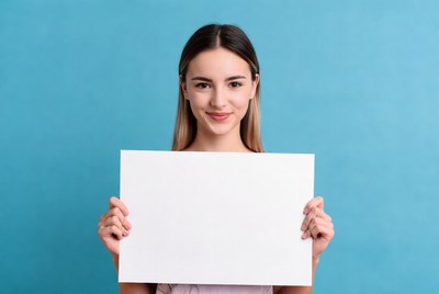 Woman holding blank sign indoors