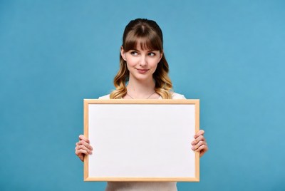Holding a blank frame in studio