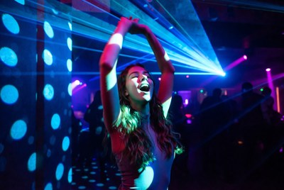 Dancing in vibrant club lights