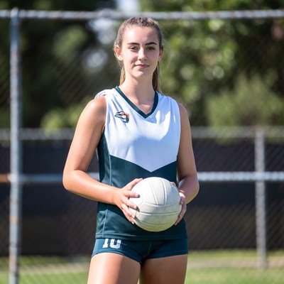 Young athlete poses with volleyball