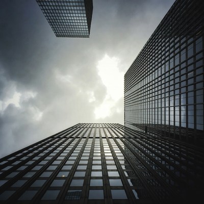 Tall buildings under dark clouds