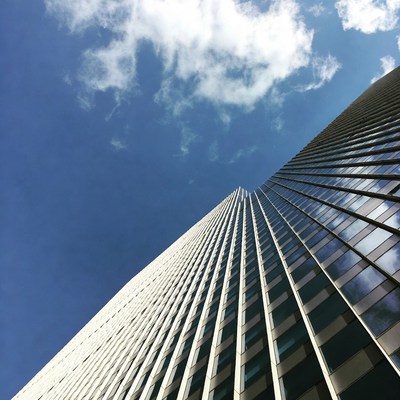 Modern skyscraper against blue sky