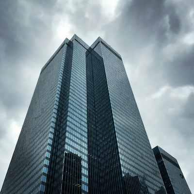 Modern skyscrapers under cloudy sky