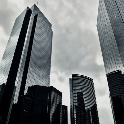Urban skyline under cloudy skies