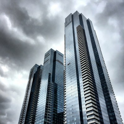 Modern skyscrapers under cloudy sky