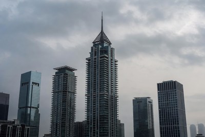 Modern skyscrapers against cloudy sky