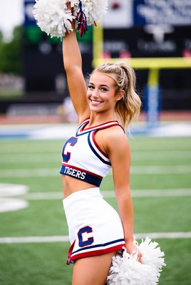 Cheerleader performing at football field event