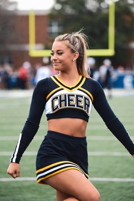 Cheerleader performing at football game