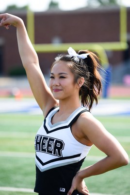 Cheerleader performing at outdoor game