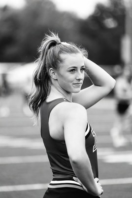 Cheerleader posing on the field