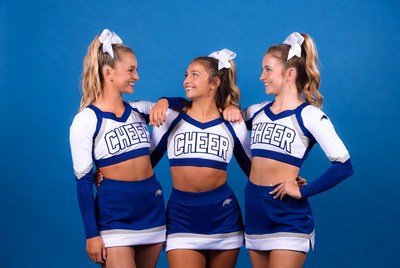Cheerleaders posing together in uniform