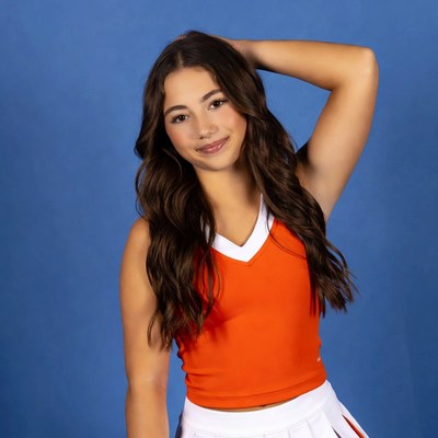 Cheerleader posing in vibrant outfit