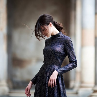 Elegant woman in dark dress