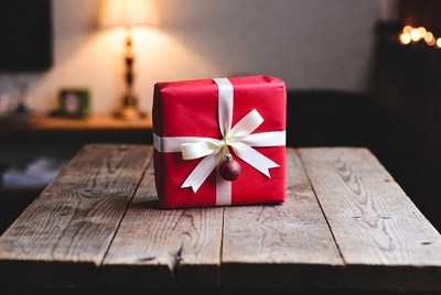 Red gift box on wooden table
