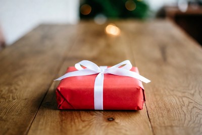 Wrapped gift on wooden table