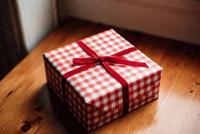 Festive wrapped gift on table