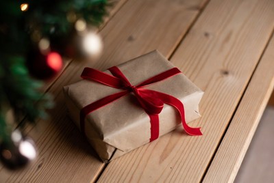 Wrapped gift on wooden table