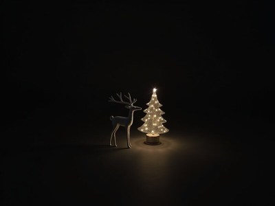Glowing reindeer with lit christmas tree