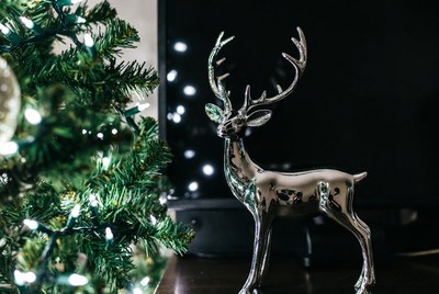 Silver reindeer by the christmas tree