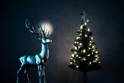 Decorative reindeer and christmas tree scene