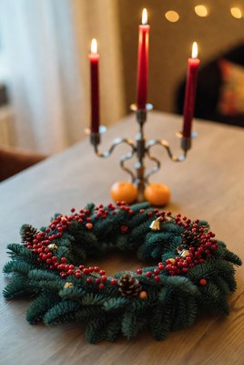 Festive wreath and candle display at home