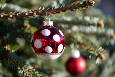 Red and white christmas ornament on tree