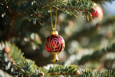 Sparkling christmas ornament hanging on tree