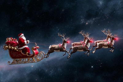 Santa claus flying through the night sky