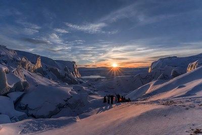 Sunset over snowy glacier landscape