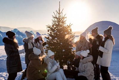 Winter celebration with friends by christmas tree