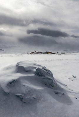 Snowy landscape with distant village