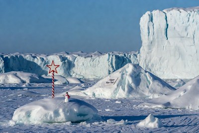 Snowman and festive decoration in icy landscape