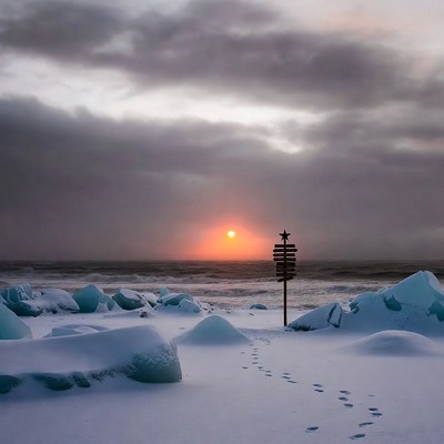 Sunset over snowy shoreline