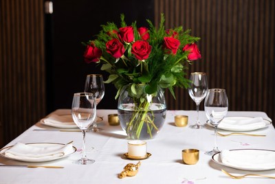 Elegant dinner table with roses