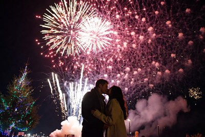 Couple kissing during fireworks celebration