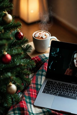 Cozy winter evening with movie and drink