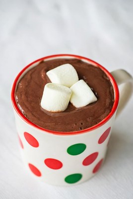 Warm cocoa with marshmallows in a cozy mug