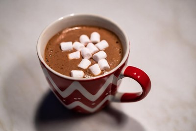 Warm cocoa with marshmallows in red mug