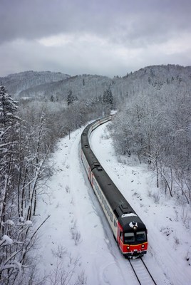 Winter train journey through snowy landscape