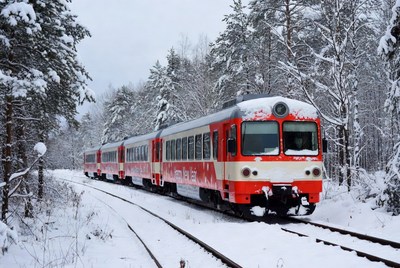 Snowy train on winter tracks